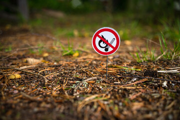 A round sign prohibiting the use of an open fire in nature. Bonfires are prohibited. A flammable...