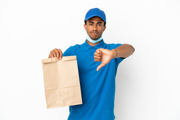 African American man taking a bag of takeaway food isolated on white background showing thumb down with negative expression