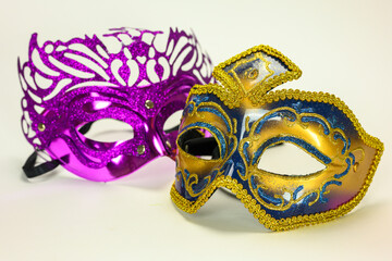 Two Venetian masks on a white background for the carnival masquerade ball.