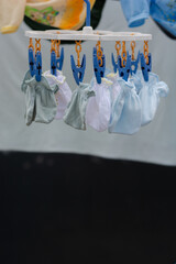 baby clothes hanging on a clothesline. clothes drying on the clothesline