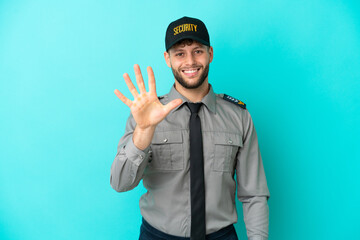 Young security man isolated on blue background counting five with fingers