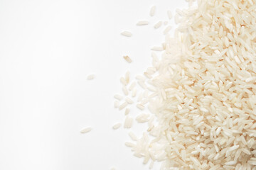 Polished long-grain rice on a white background.