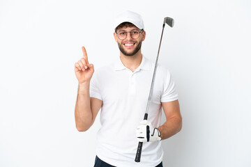 Handsome young man playing golf  isolated on white background showing and lifting a finger in sign of the best