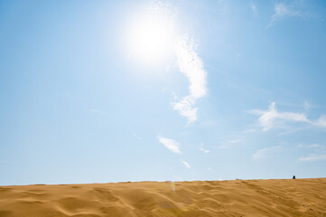 Fototapeta na wymiar Picturesque View of The Sarykum Dune in Dagestan Against A Clear Sky