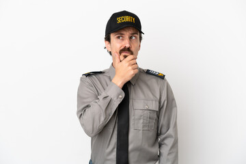Young caucasian security man isolated on white background having doubts and with confuse face expression