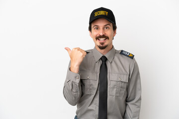Young caucasian security man isolated on white background pointing to the side to present a product
