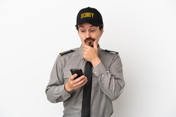 Young caucasian security man isolated on white background thinking and sending a message