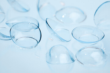 contact lenses on blue background close up view   - Image