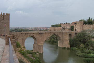 view of the San Martin bridge at sunset in Toledo. Spain