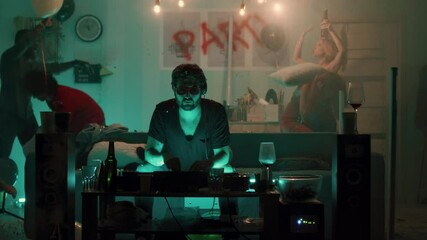 DJ working during party in living room