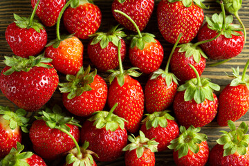 Fresh ripe strawberry with water drops on black background. Macro image. High quality photo