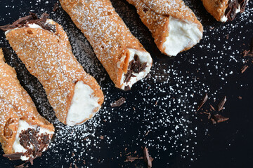 Homemade sicilian cannoli with ricotta and chocolate chips. Top view.