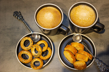 ruddy loaf on the table and close bagels and cup of coffee
