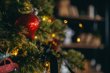 Close-up photo of Christmas decorations on the Christmas tree, multicolored red balls