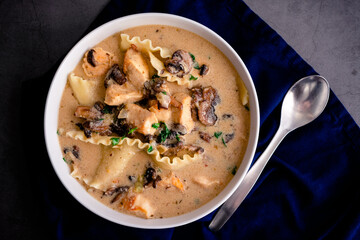 Roasted Garlic White Chicken Lasagna Soup: Bowl of soup made with lasagne noodles, alfredo sauce, and mushrooms