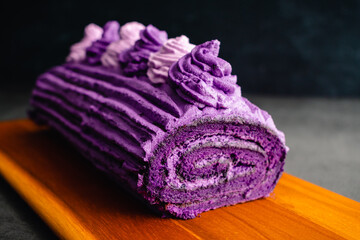 Ube Cake Roll with Whipped Cream Frosting: Roulade made with purple sweet potatoes and whipped...