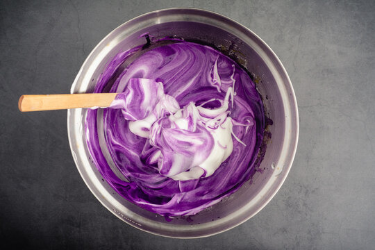 Mixing Meringue Into Ube Cake Batter: Using A Spatula To Mix Up Cake Batter Made With Purple Sweet Potatoes