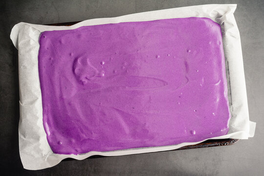 Uncooked Ube Cake Batter In A Sheet Pan: Raw Cake Batter Made With Purple Sweet Potatoes