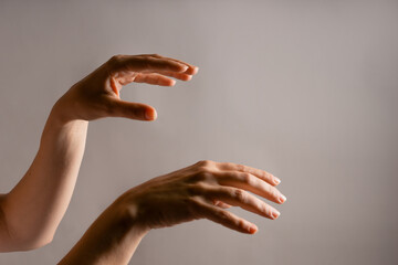 Elegant female hand, pointing to the side. palm hung down. Hand gestures