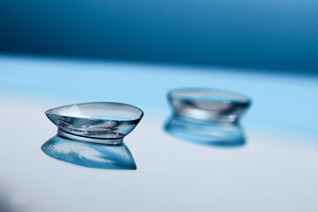 contact lenses on blue background close up view - Image