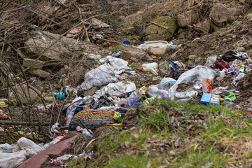 Garbage dumped on the field that pollutes the soil and air