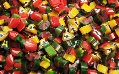Fototapeta na wymiar Delicious colorful jelly candies on background 