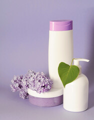 Group of cosmetic bottles on colorful background.