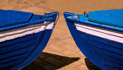 Two wooden boats face to face. Concept. Two antagonisms. Opposition.Nose to nose