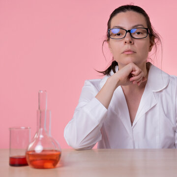 Portrait of a young woman doctor at a personal consultation. A doctor in a white coat