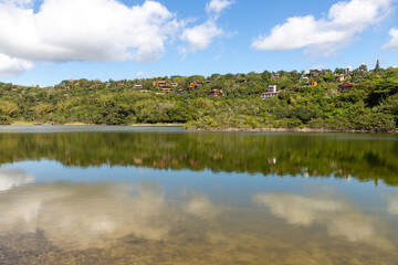 Lake with forest and houses around