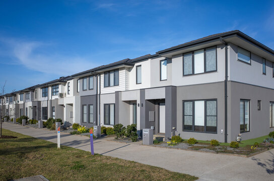 A Row Of Modern Residential Townhomes Or Townhouses In Melbourne's Suburb, VIC Australia. Concept Of Real Estate Development, The Housing Market, And Homeownership..