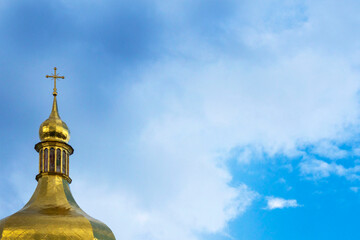 Fototapeta na wymiar Gold domes of Christian churches. House of prayer. religion concept, faith in god. Domes with crosses against the background of the beautiful sky with clouds.