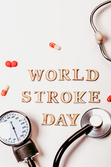 World Stroke Day. red heart and stethoscope on background, top view. Cardiology concept