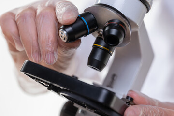 Examination of samples under a microscope, science or training.