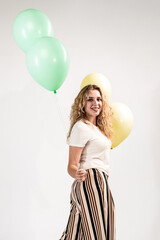 Funny girl with colored balls on a white background. (isolated on white)