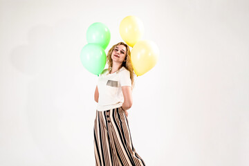 Funny girl with colored balls on a white background. (isolated on white)