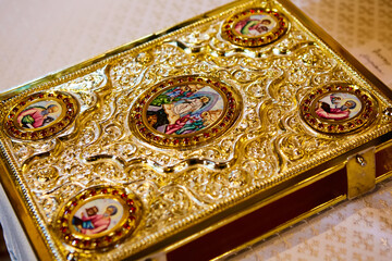 Holy Bible book in gold. Shallow dof.