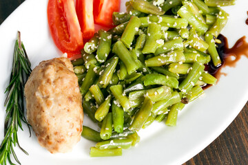 baked asparagus beans with sesame seeds and meat cutlet