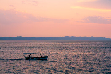 Fishing boat in sunset