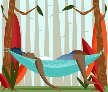 Woman relaxing in a hammock in the forest 