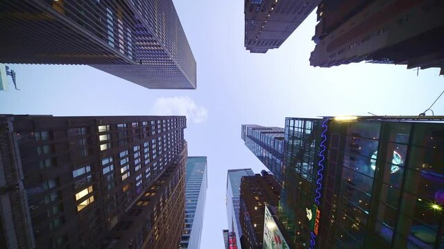 Looking up modern office buildings, high glassy skyscraper, modern offices apartments in New York City. Financial district Manhattan.