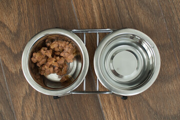 Wet food for dogs and cats in a bowl close up