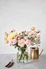 Finished flower arrangement in a vase for home. Flowers bunch, set for interior. Fresh cut flowers for decoration home. European floral shop. Delivery fresh cut flower.