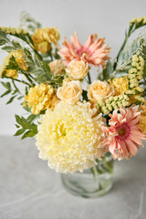 Finished flower arrangement in a vase for home. Flowers bunch, set for interior. Fresh cut flowers for decoration home. European floral shop. Delivery fresh cut flower.