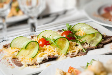 grated classic cheese grated with sliced cucumbers