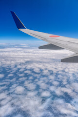 Fototapeta na wymiar 日本の空の旅　機窓風景ウイングレットと雲海