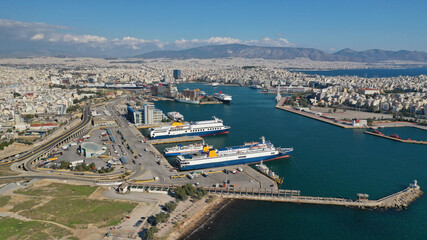Fototapeta na wymiar Aerial drone photo of famous and busy port of Piraeus where passenger ferries travel to Aegean destination islands as seen from high altitude , Attica, Greece