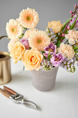 Finished flower arrangement in a vase for home. Flowers bunch, set for interior. Fresh cut flowers for decoration home. European floral shop. Delivery fresh cut flower.