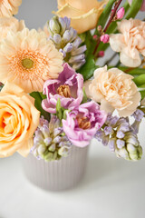 Finished flower arrangement in a vase for home. Flowers bunch, set for interior. Fresh cut flowers for decoration home. European floral shop. Delivery fresh cut flower.