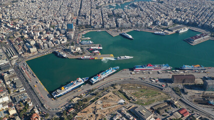 Aerial drone photo of famous and busy port of Piraeus where passenger ferries travel to Aegean...